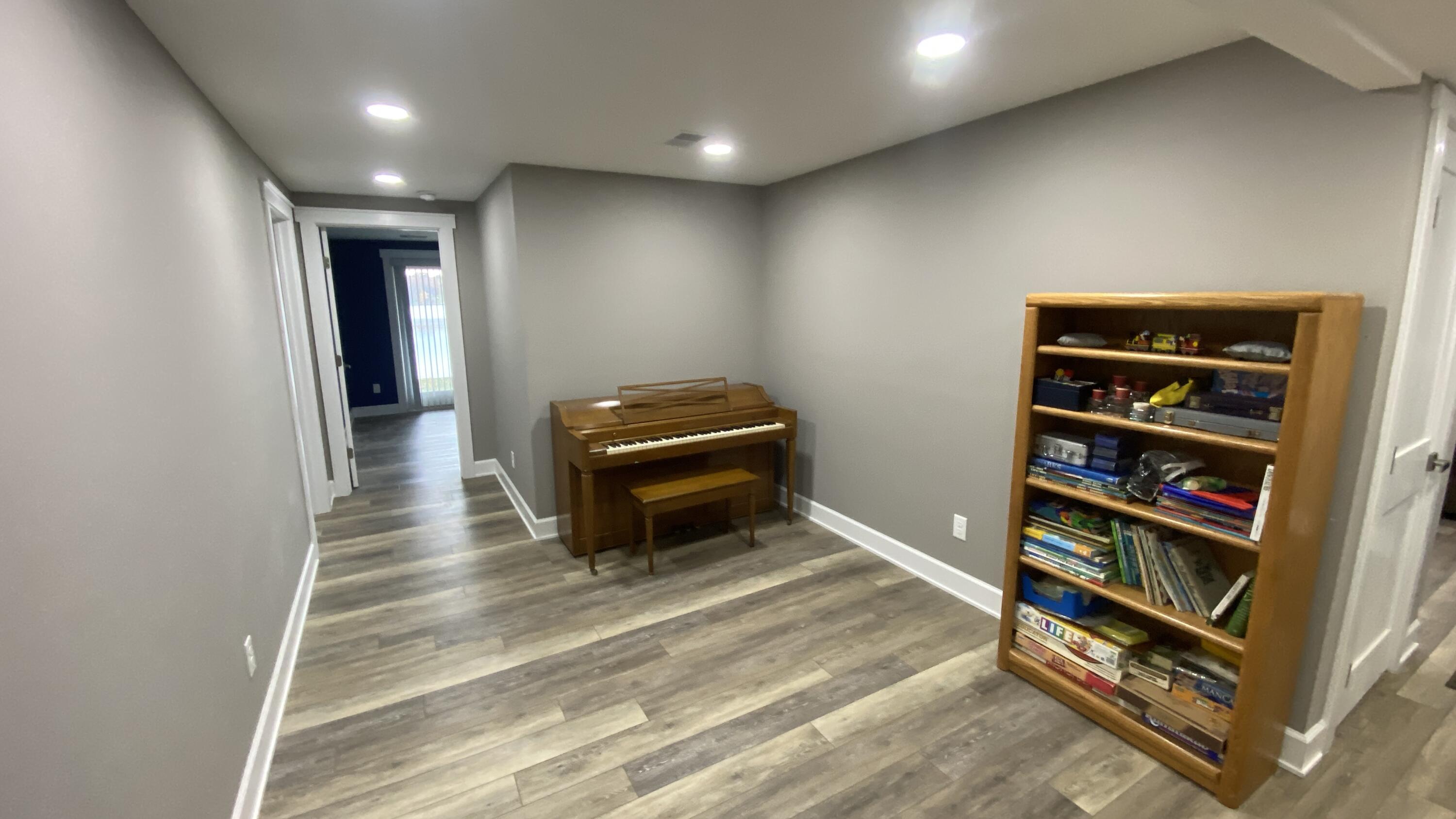 1728 Beachview Court Crown Point, IN 46307 - Photo 66 of 114 a room with furniture and a book shelf