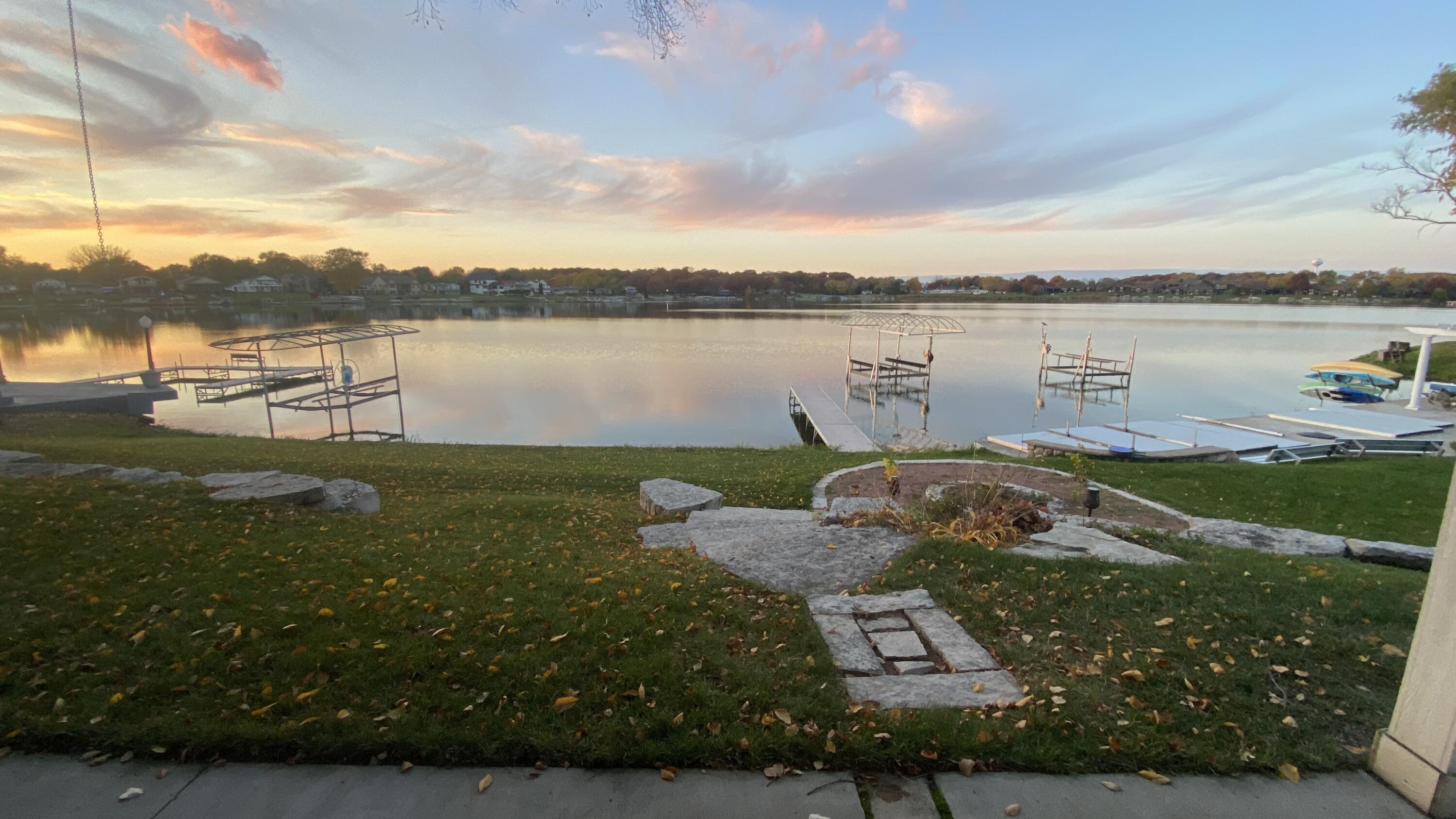 1728 Beachview Court Crown Point, IN 46307 - Photo 69 of 114 a view of a lake with houses in the back