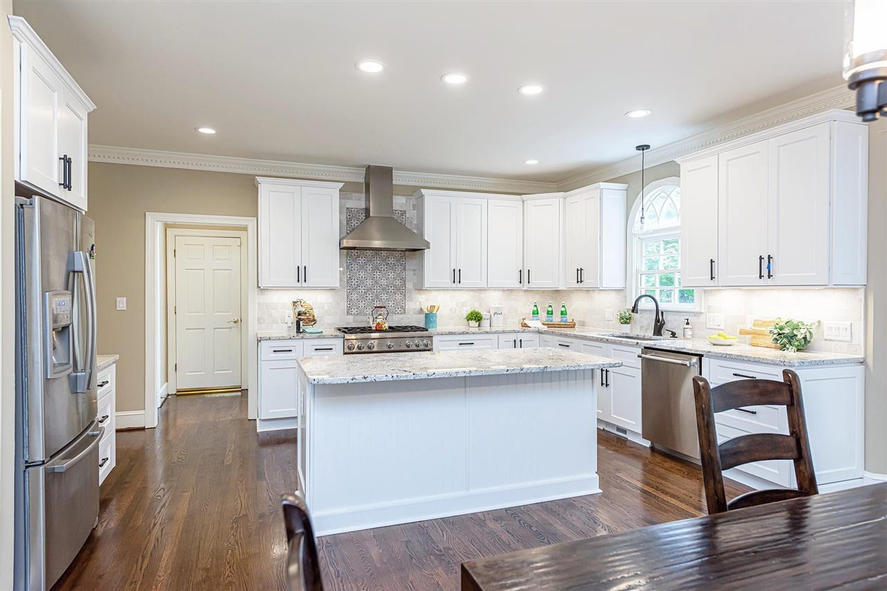 Gourmet Kitchen featuring granite counters, island w/overhand, and lots of cabinet space. Kitchen