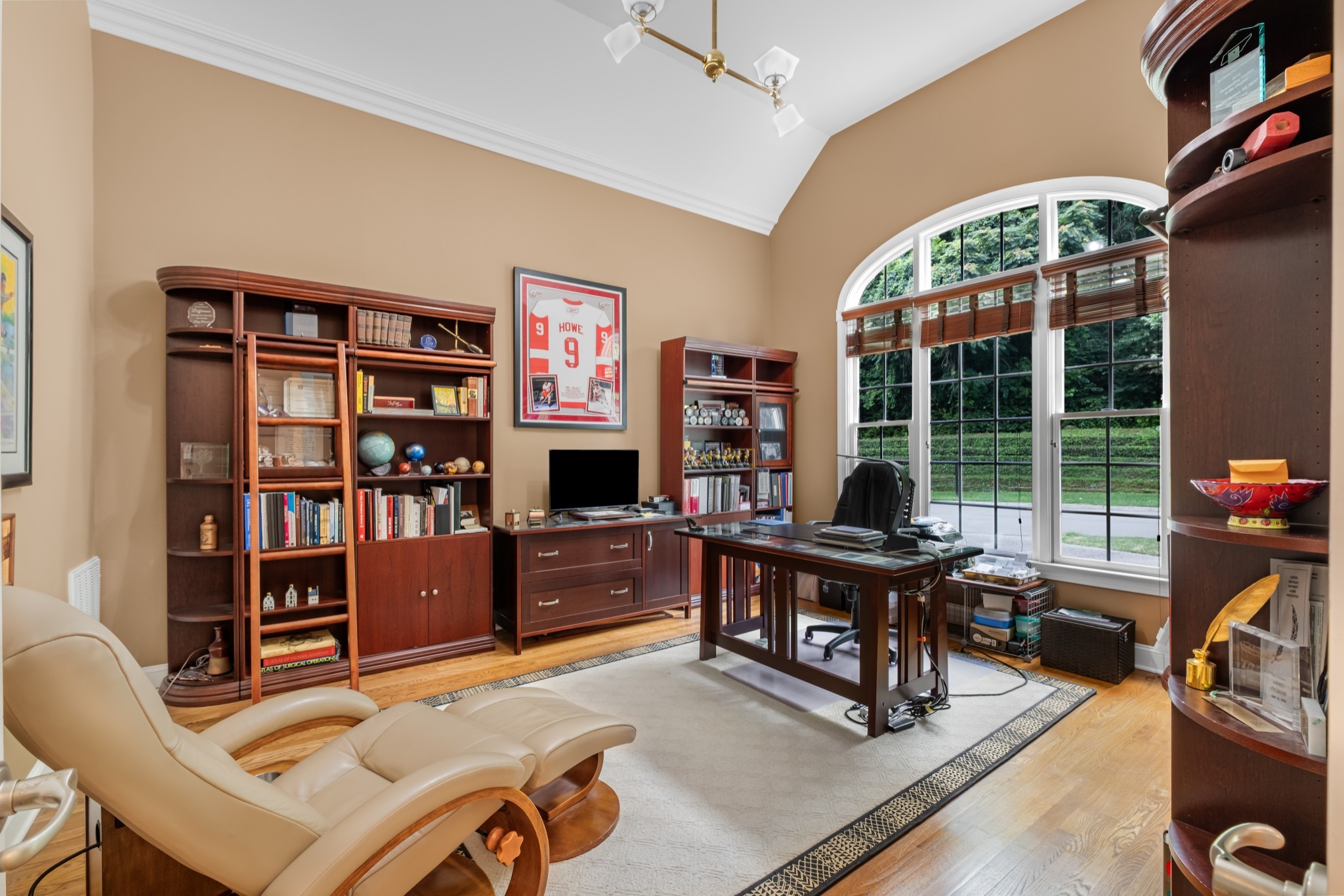 424 Sandcastle Road Franklin, TN 37069 - Photo 11 of 65 a work room with furniture a bookshelf and a large window