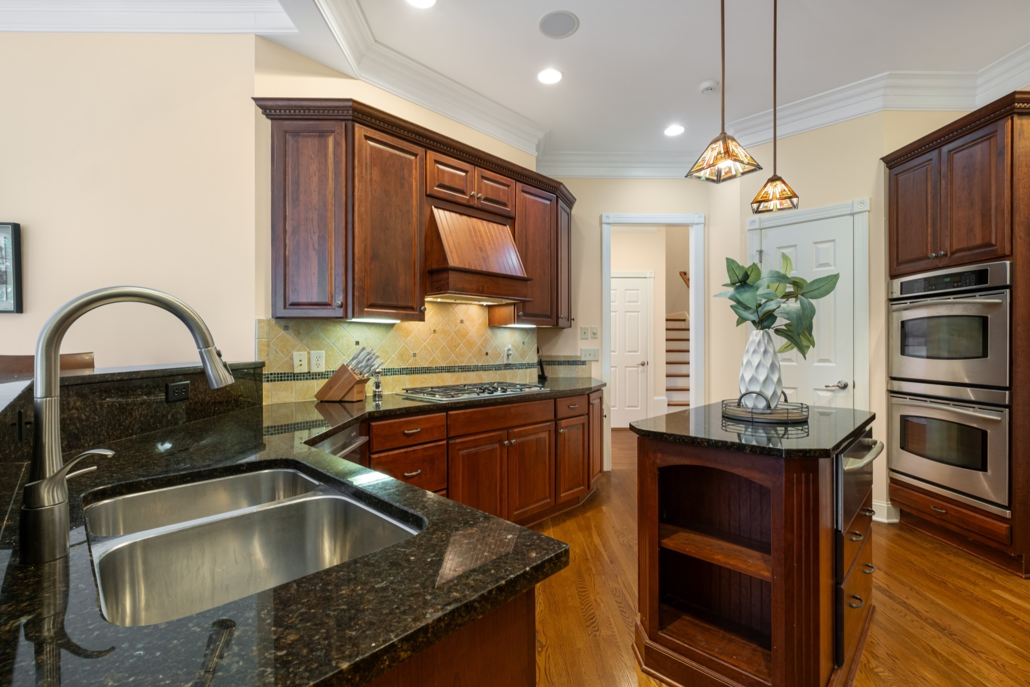 424 Sandcastle Road Franklin, TN 37069 - Photo 19 of 65 a kitchen with a sink stove and microwave