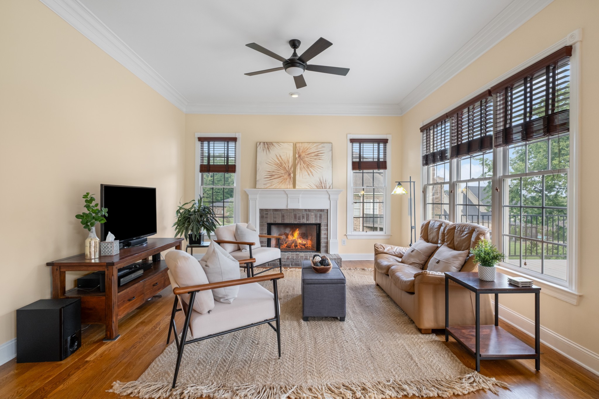 424 Sandcastle Road Franklin, TN 37069 - Photo 23 of 65 a living room with furniture a fireplace and a flat screen tv