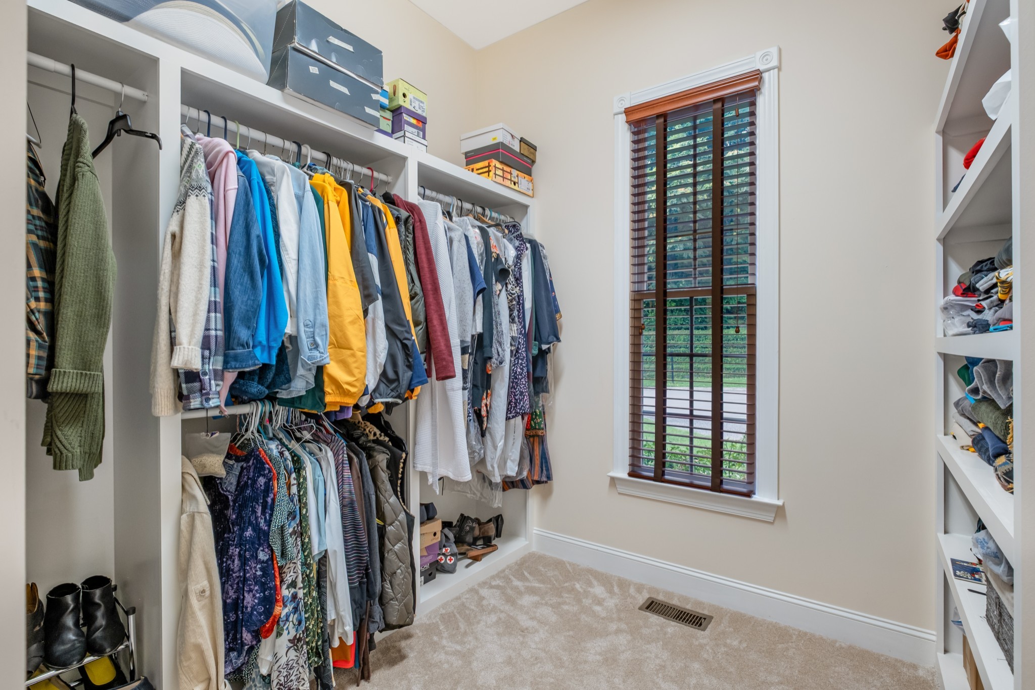 424 Sandcastle Road Franklin, TN 37069 - Photo 34 of 65 a view of walk in closet with clothes and shoes