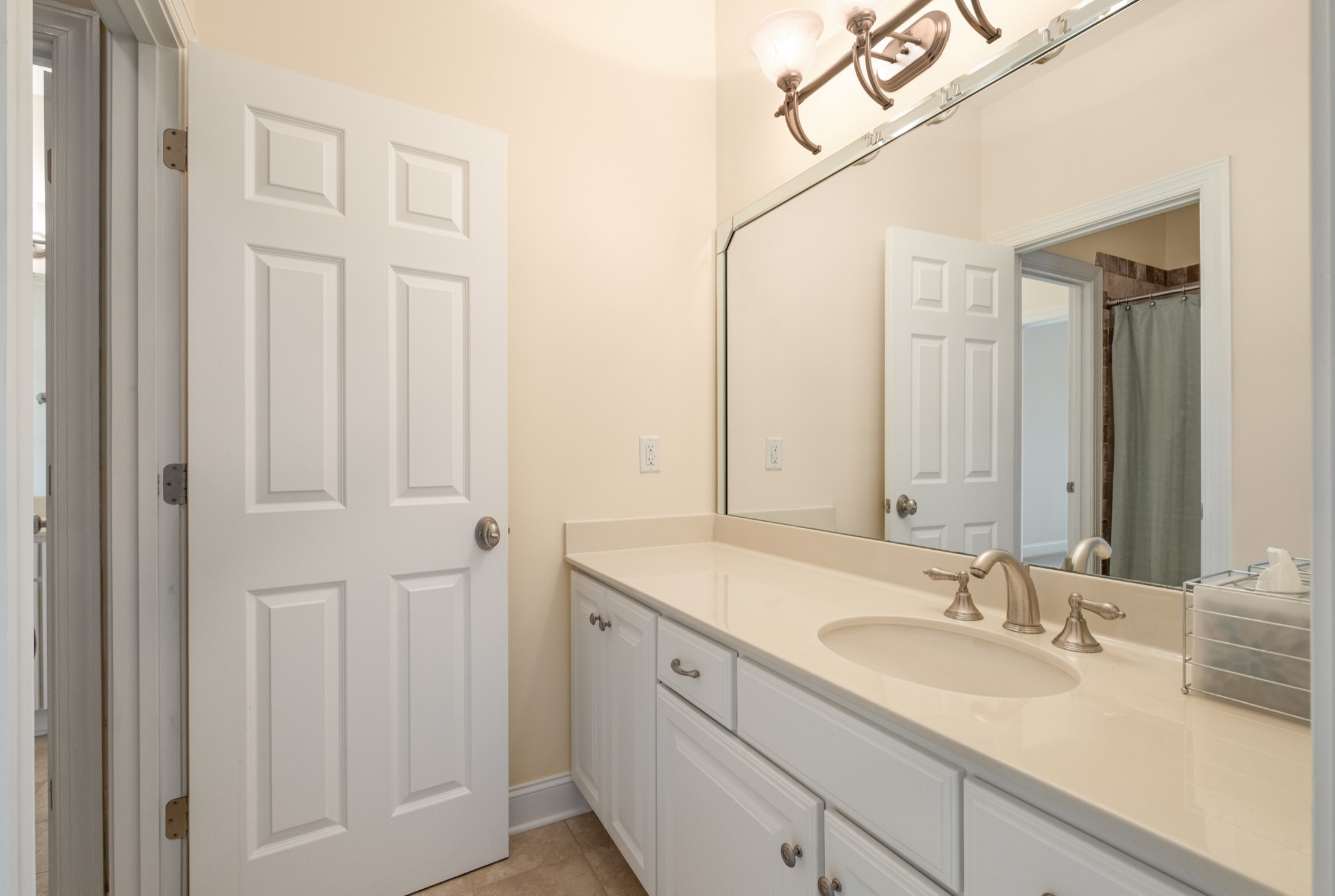 424 Sandcastle Road Franklin, TN 37069 - Photo 42 of 65 a bathroom with a sink and a mirror