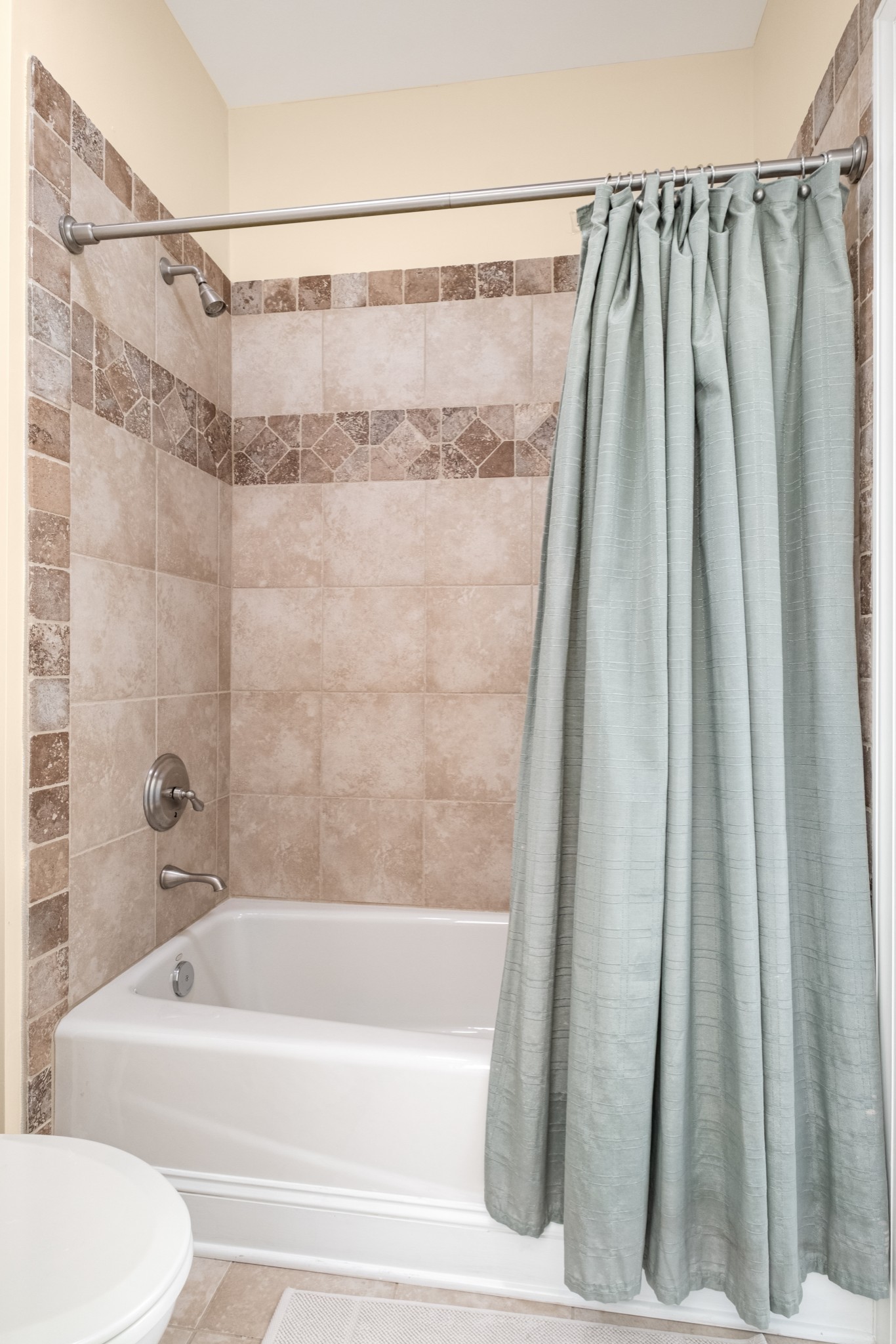 424 Sandcastle Road Franklin, TN 37069 - Photo 43 of 65 a bathroom with a shower curtain and a bath tub