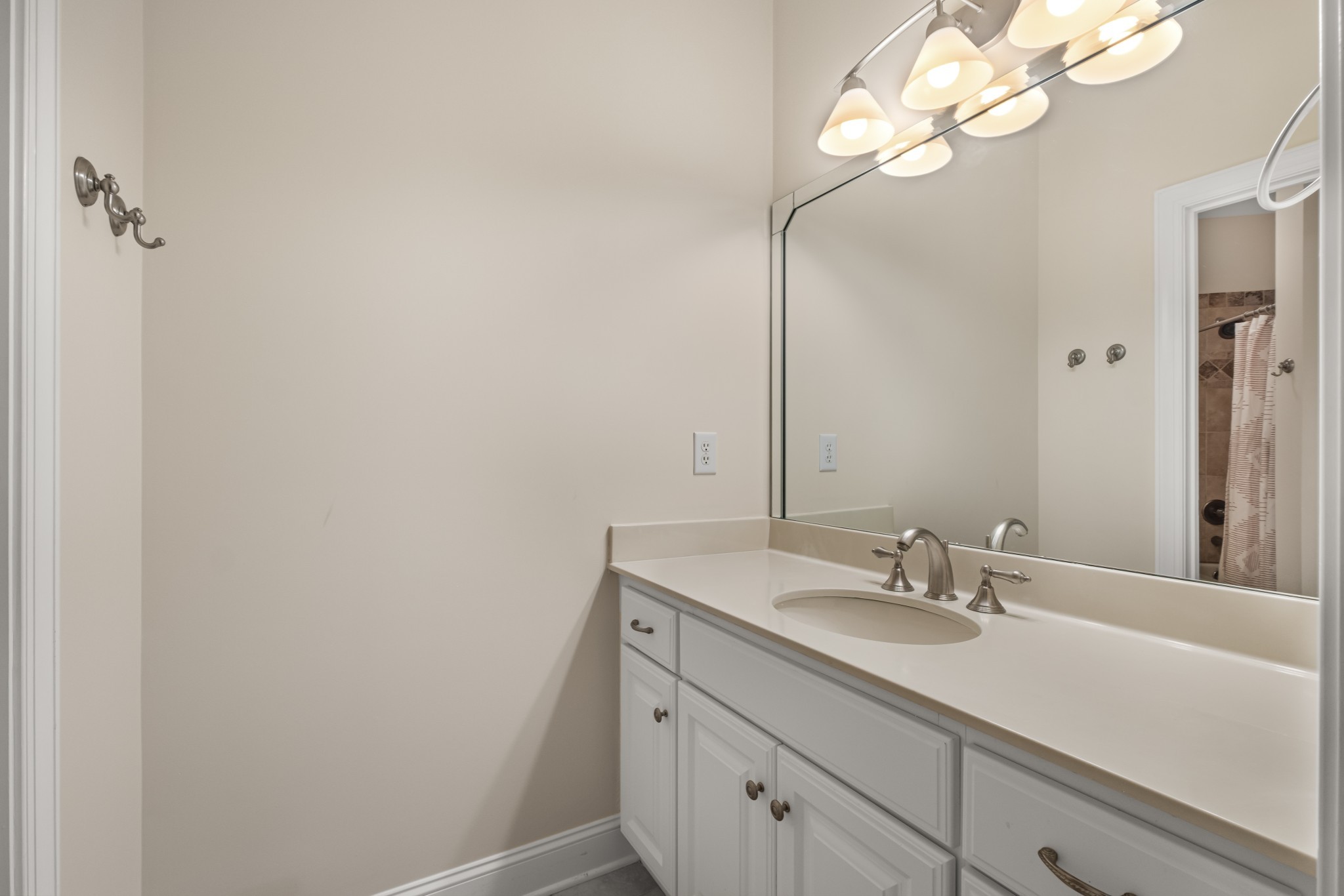 424 Sandcastle Road Franklin, TN 37069 - Photo 49 of 65 a bathroom with a sink a light fixture and a mirror