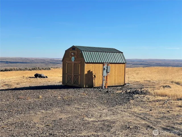 a view of a tiny house with a yard