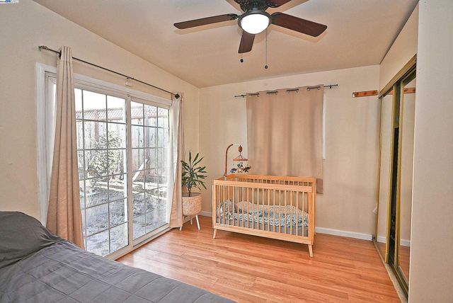 a view of a room with wooden floor and windows