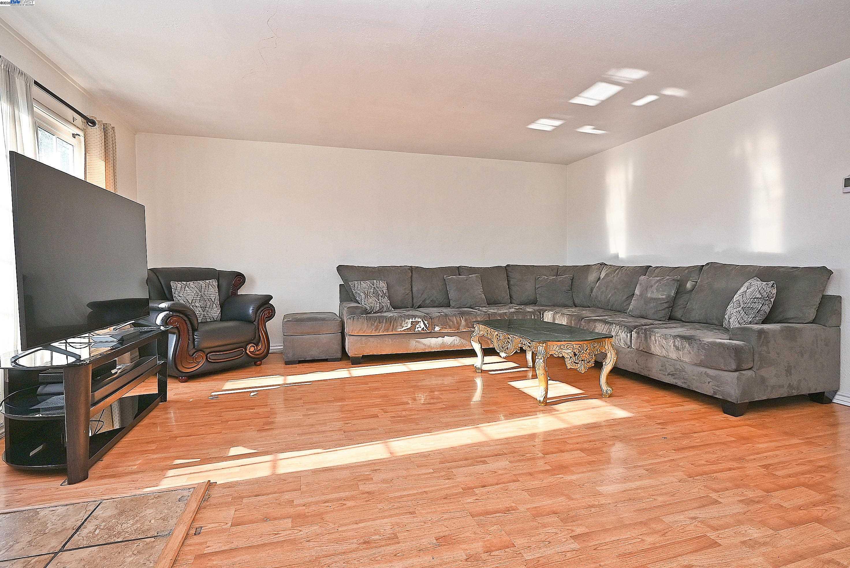 19092 Ricardo Avenue San Lorenzo, CA 94541 - Photo 7 of 29 a living room with furniture and a flat screen tv