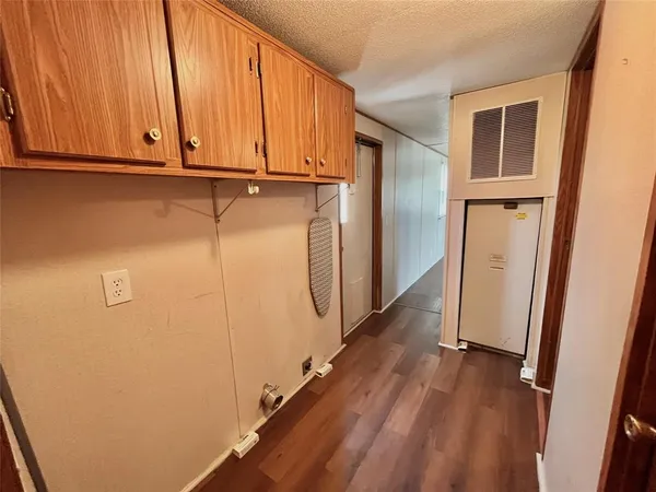 a view of a storage & utility room with wooden floor