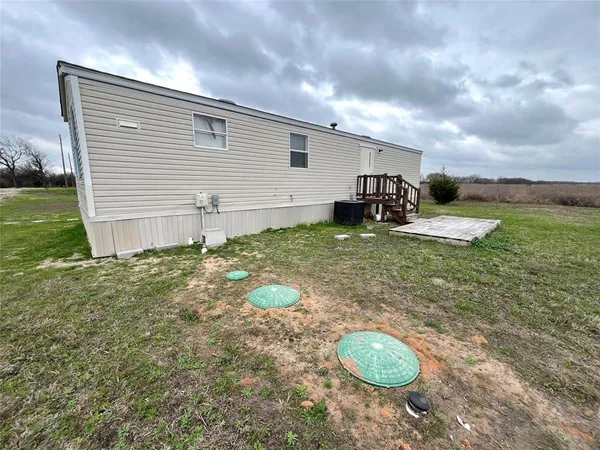 a view of a backyard of the house