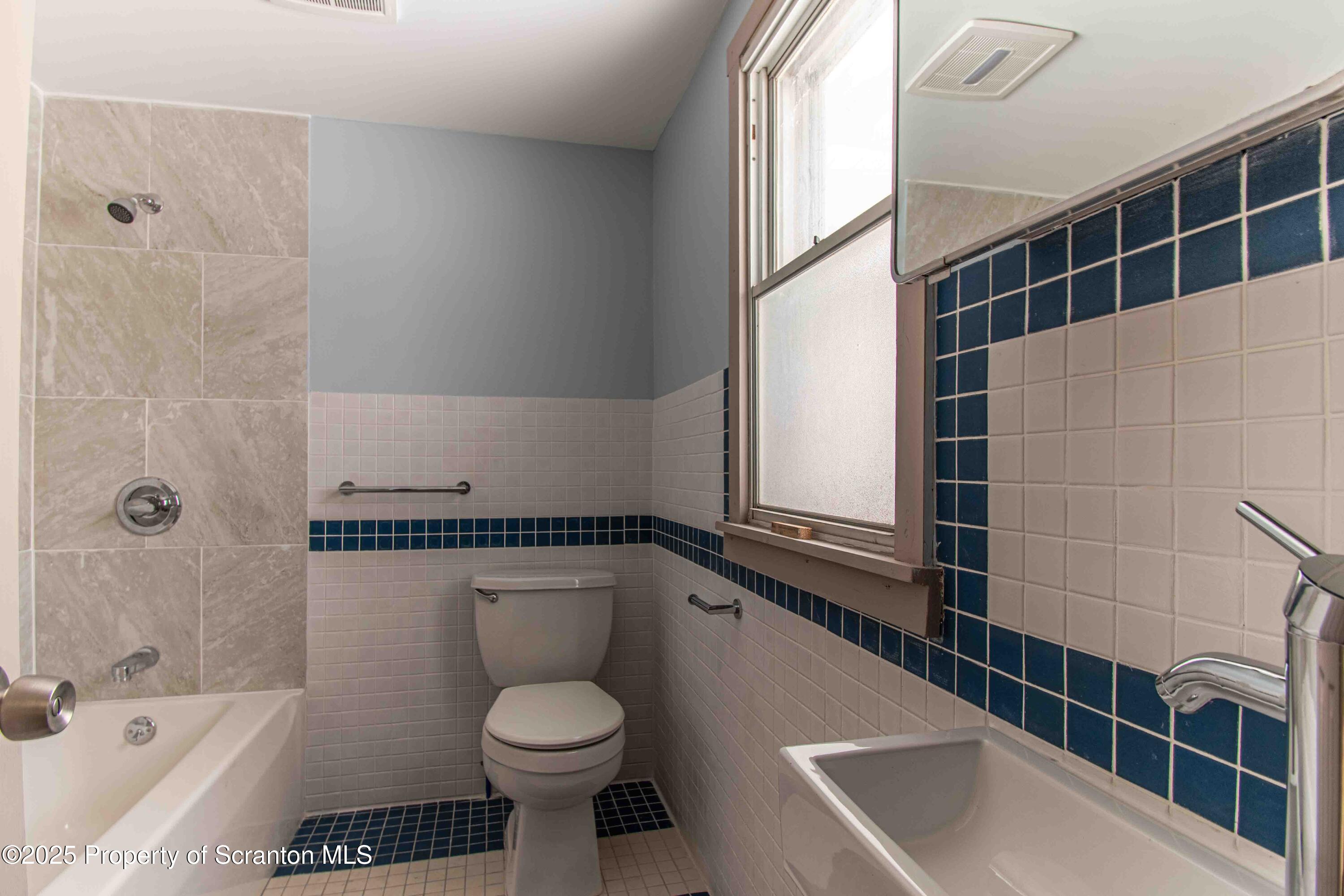 540 North Main Street Simpson, PA 18407 - Photo 5 of 17 a bathroom with a toilet a sink and bathtub