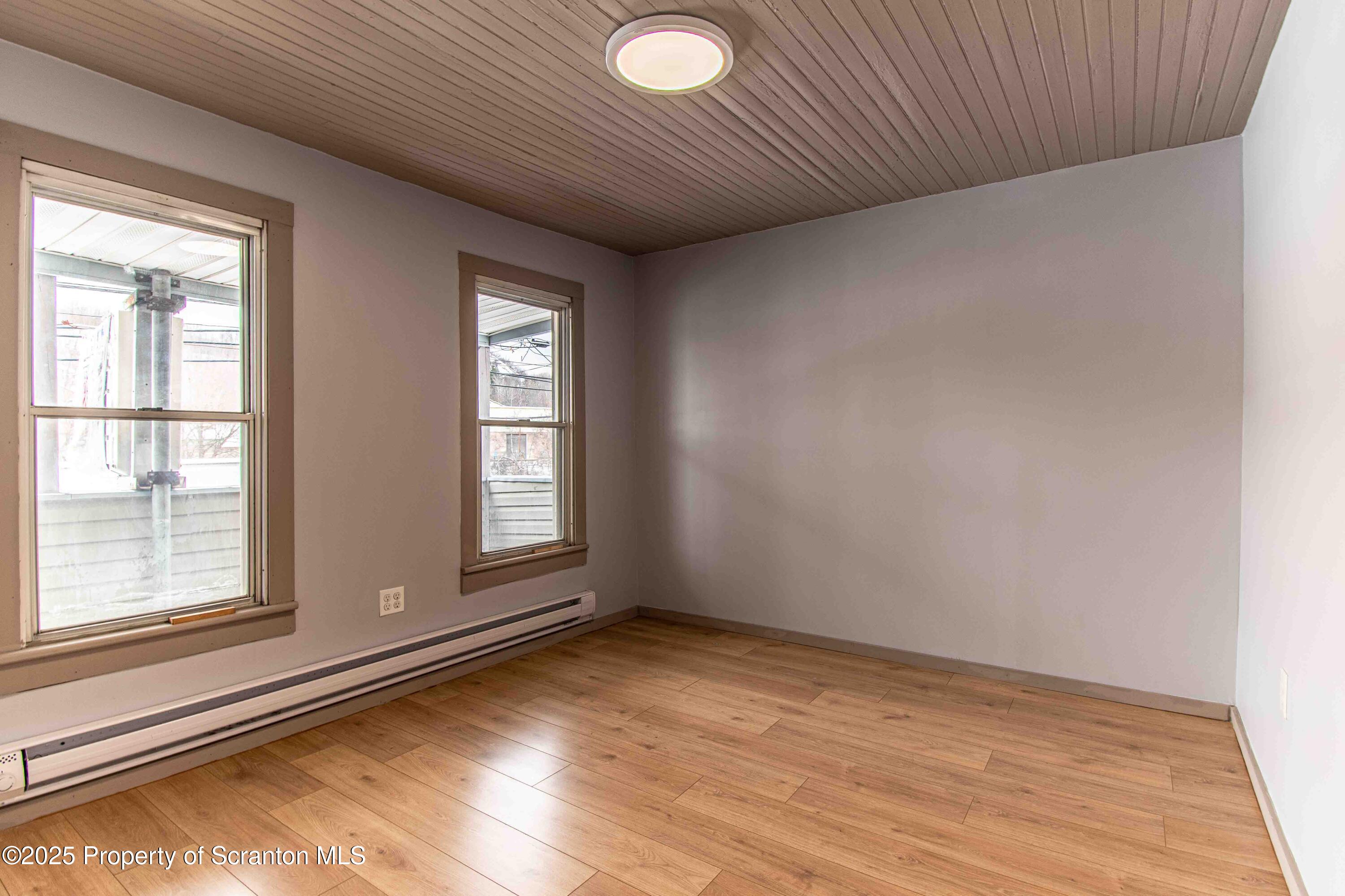 540 North Main Street Simpson, PA 18407 - Photo 8 of 17 a view of empty room with wooden floor and fan