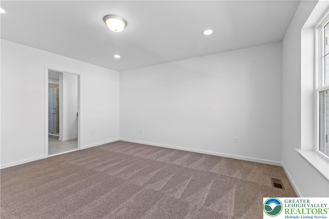 93 Timber Trail, Unit 46 Easton, PA 18045 - Photo 17 of 26 wooden floor in an empty room with a window