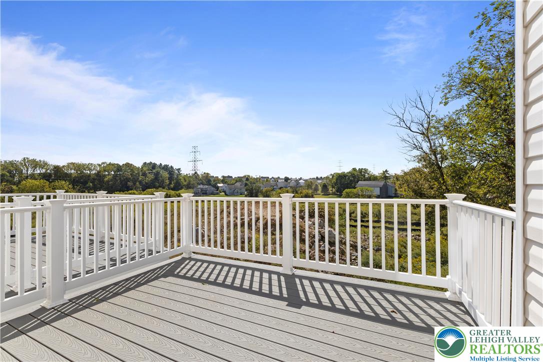 93 Timber Trail, Unit 46 Easton, PA 18045 - Photo 25 of 26 a balcony with wooden floor and fence