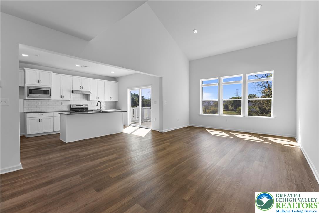 93 Timber Trail, Unit 46 Easton, PA 18045 - Photo 6 of 26 a view of kitchen with wooden floor and windows