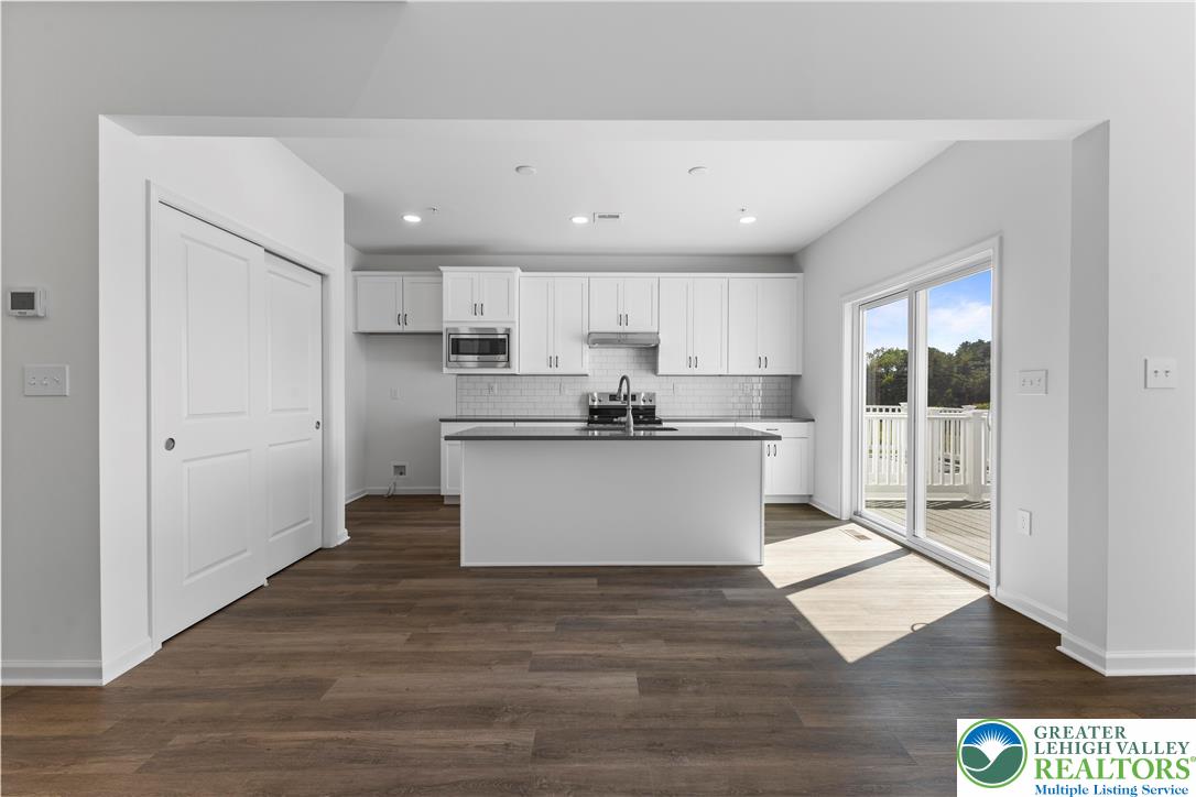 93 Timber Trail, Unit 46 Easton, PA 18045 - Photo 9 of 26 a view of kitchen with kitchen island wooden cabinets and stainless steel appliances