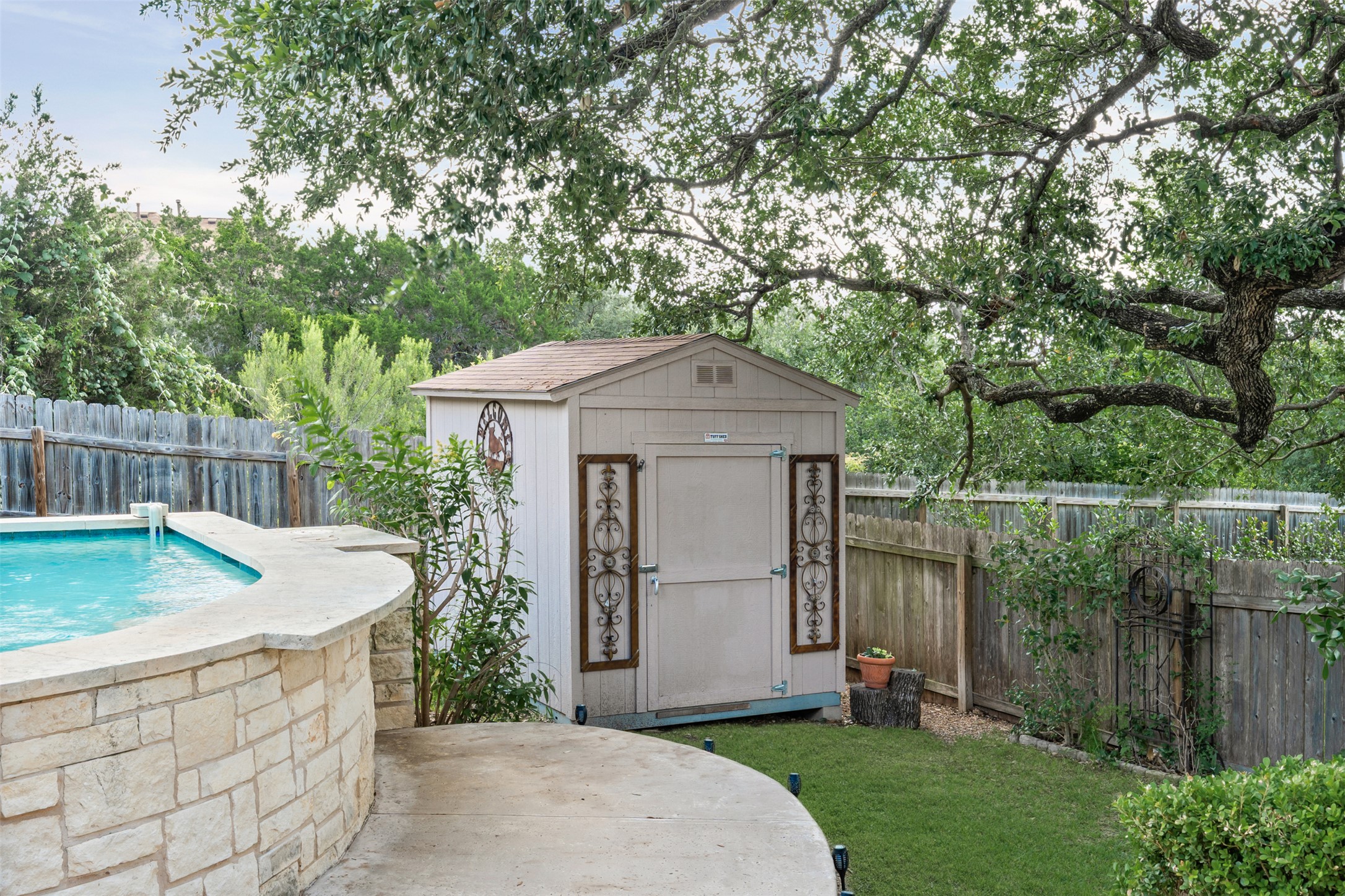 8820 Colberg Drive Austin, TX 78749 - Photo 29 of 35 A private backyard oasis features a glistening pool and a convenient storage shed.