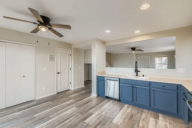 a view of room with sink and wooden floor