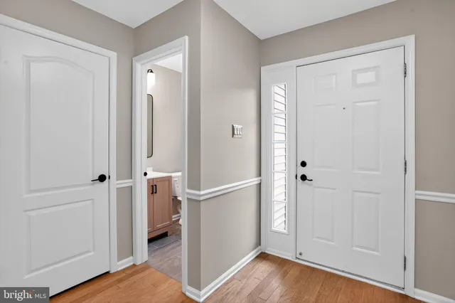 a view of a bathroom with wooden floor