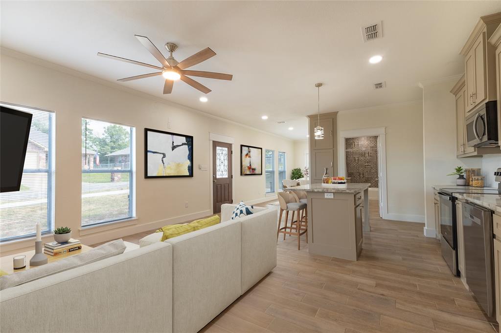 412 Crosby Street Lindale, TX 75771 - Photo 14 of 36 a living room with furniture and a flat screen tv