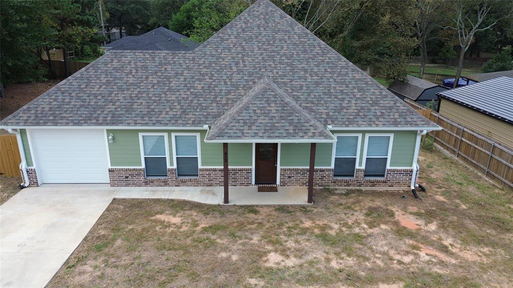 412 Crosby Street Lindale, TX 75771 - Photo 2 of 36 front view of a house with yard outdoor seating and plants