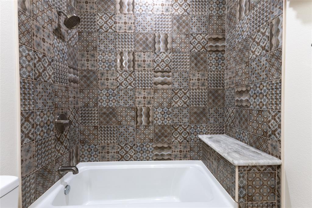 412 Crosby Street Lindale, TX 75771 - Photo 23 of 36 a bathroom with a bathtub and shower