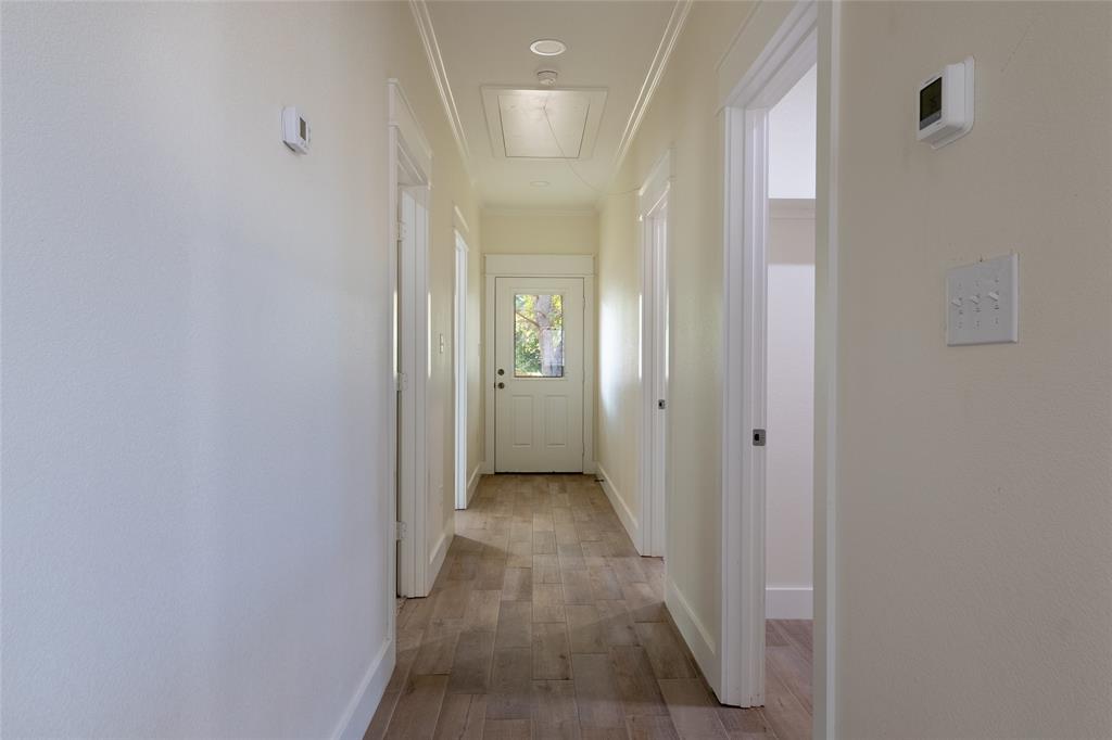 412 Crosby Street Lindale, TX 75771 - Photo 24 of 36 a view of a hallway with wooden floor