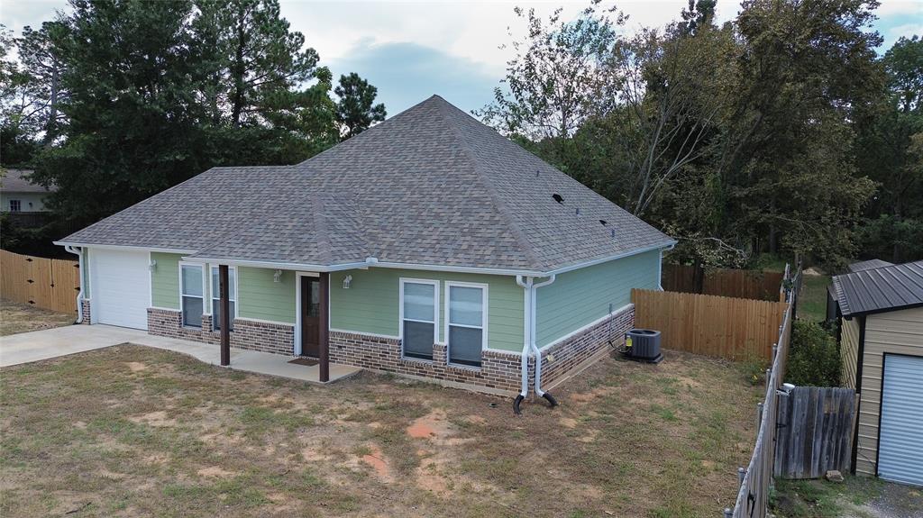 412 Crosby Street Lindale, TX 75771 - Photo 3 of 36 a house view with a backyard space