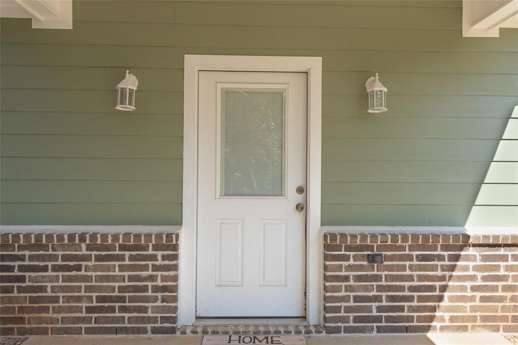 412 Crosby Street Lindale, TX 75771 - Photo 32 of 36 a bathroom with a shower