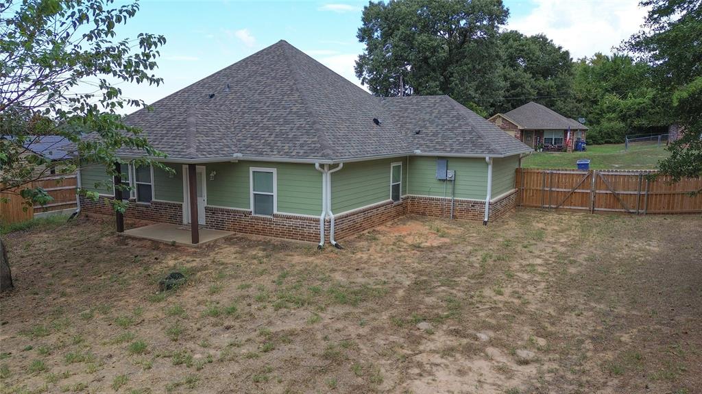 412 Crosby Street Lindale, TX 75771 - Photo 6 of 36 a house view with a garden space