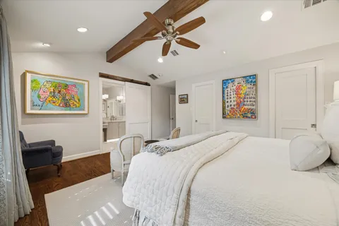 a bedroom with a bed and a couch