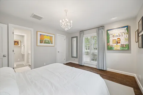 a bedroom with bed and window