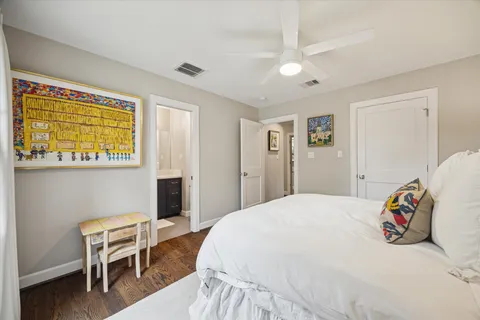 a bedroom with a bed and a chair