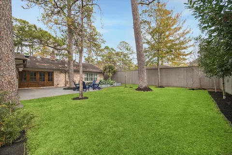 a view of backyard with a garden and entertaining space