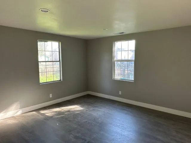 an empty room with windows