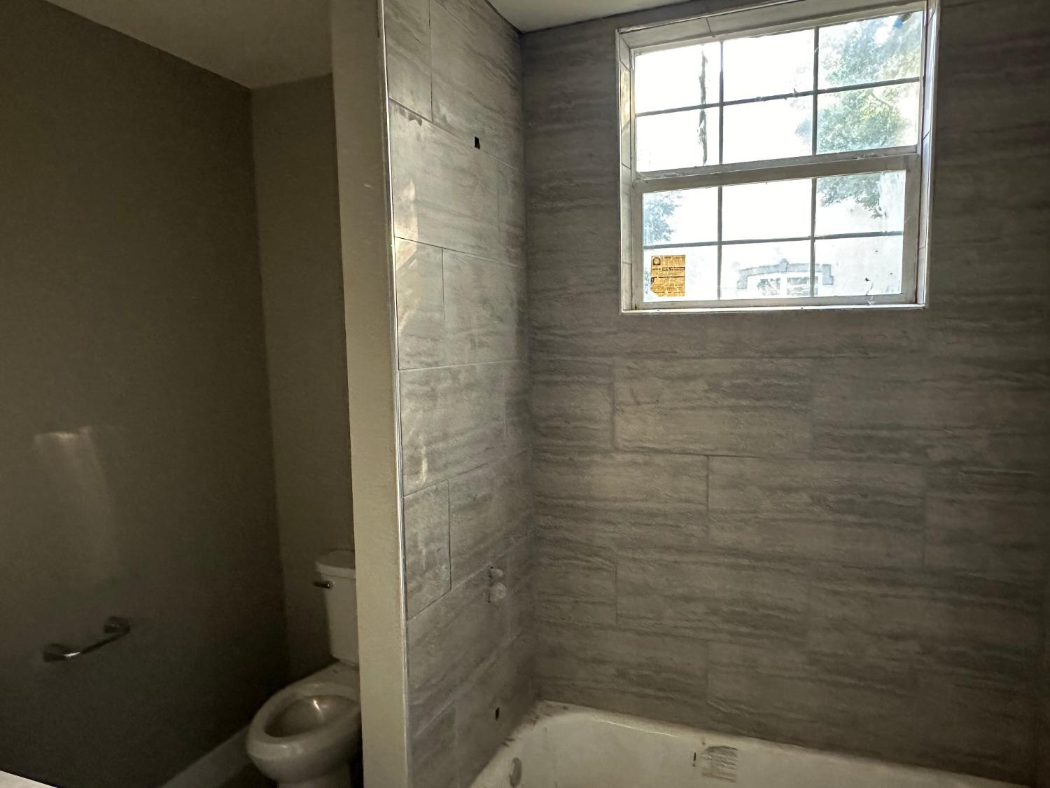 14055 River Road Walnut Grove, CA 95690 - Photo 17 of 55 a bathroom with a toilet and a shower