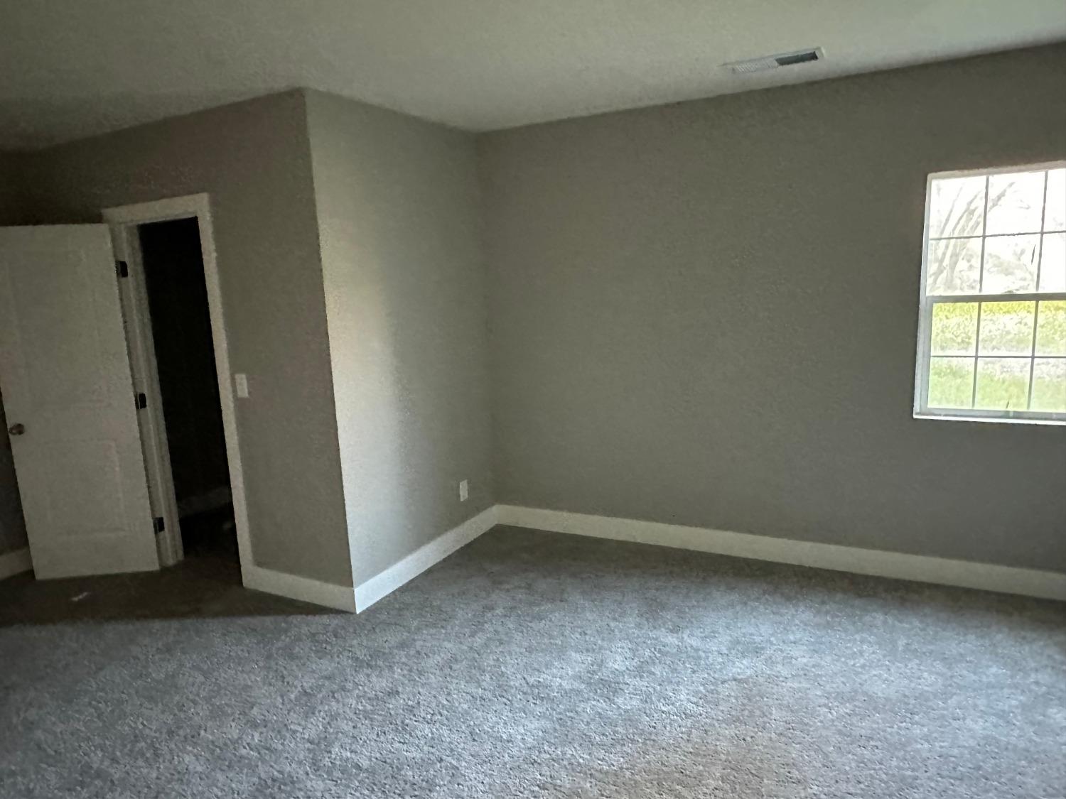 14055 River Road Walnut Grove, CA 95690 - Photo 18 of 55 an empty room with windows