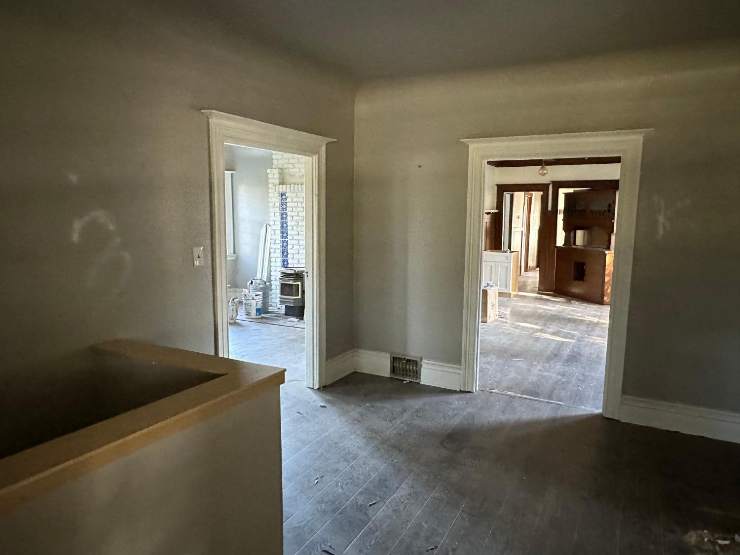 14055 River Road Walnut Grove, CA 95690 - Photo 19 of 55 an empty room with wooden floor and windows