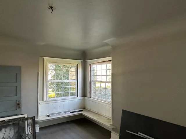 a kitchen with a refrigerator sink and cabinets