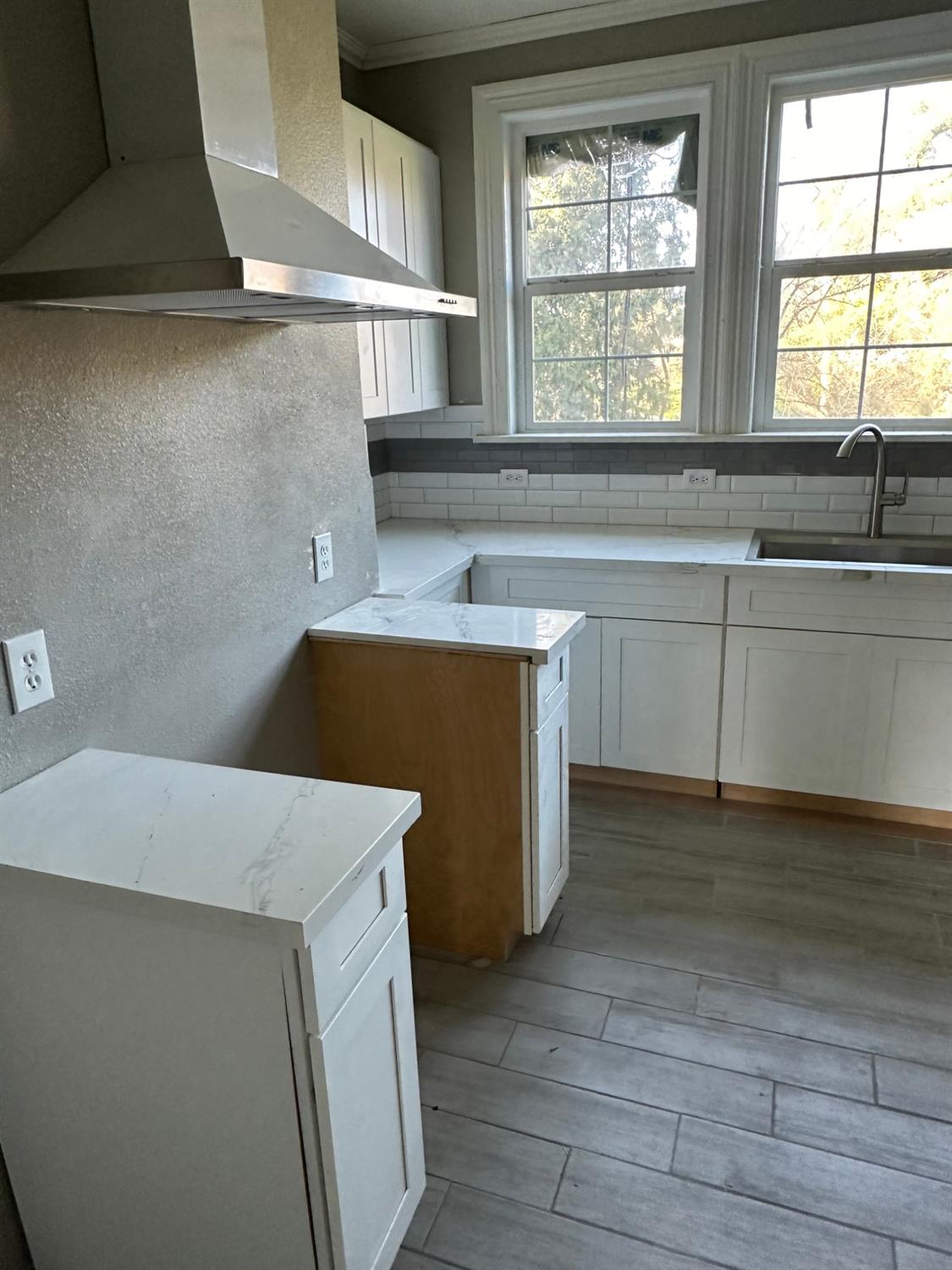 14055 River Road Walnut Grove, CA 95690 - Photo 21 of 55 a kitchen with a cabinets and a window