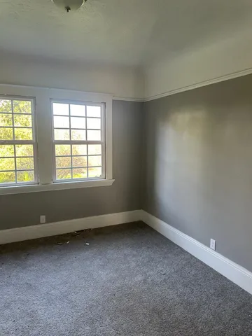 a view of walk in closet with window