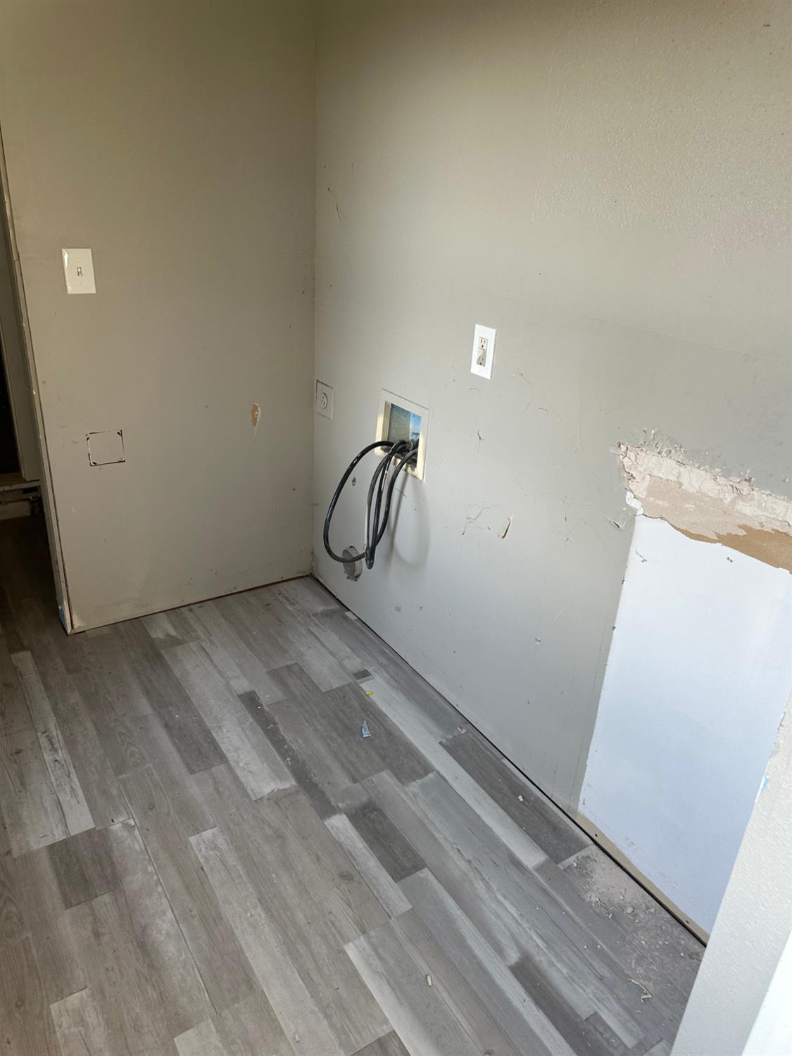 14055 River Road Walnut Grove, CA 95690 - Photo 31 of 55 a view of a room with rack on the wall