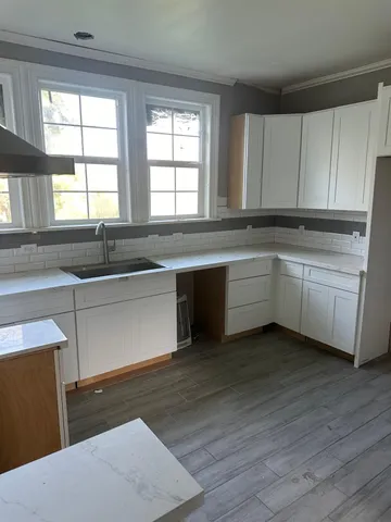 a bathroom with a sink and a shower