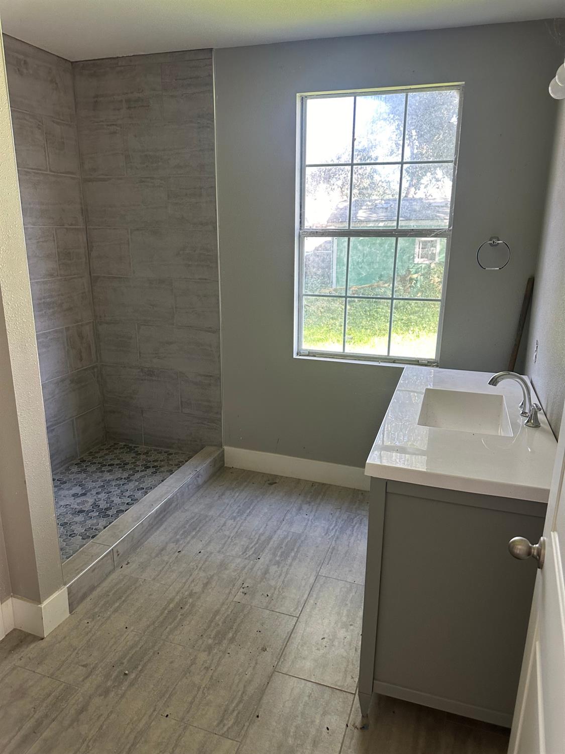 14055 River Road Walnut Grove, CA 95690 - Photo 39 of 55 a bathroom with a sink and a shower
