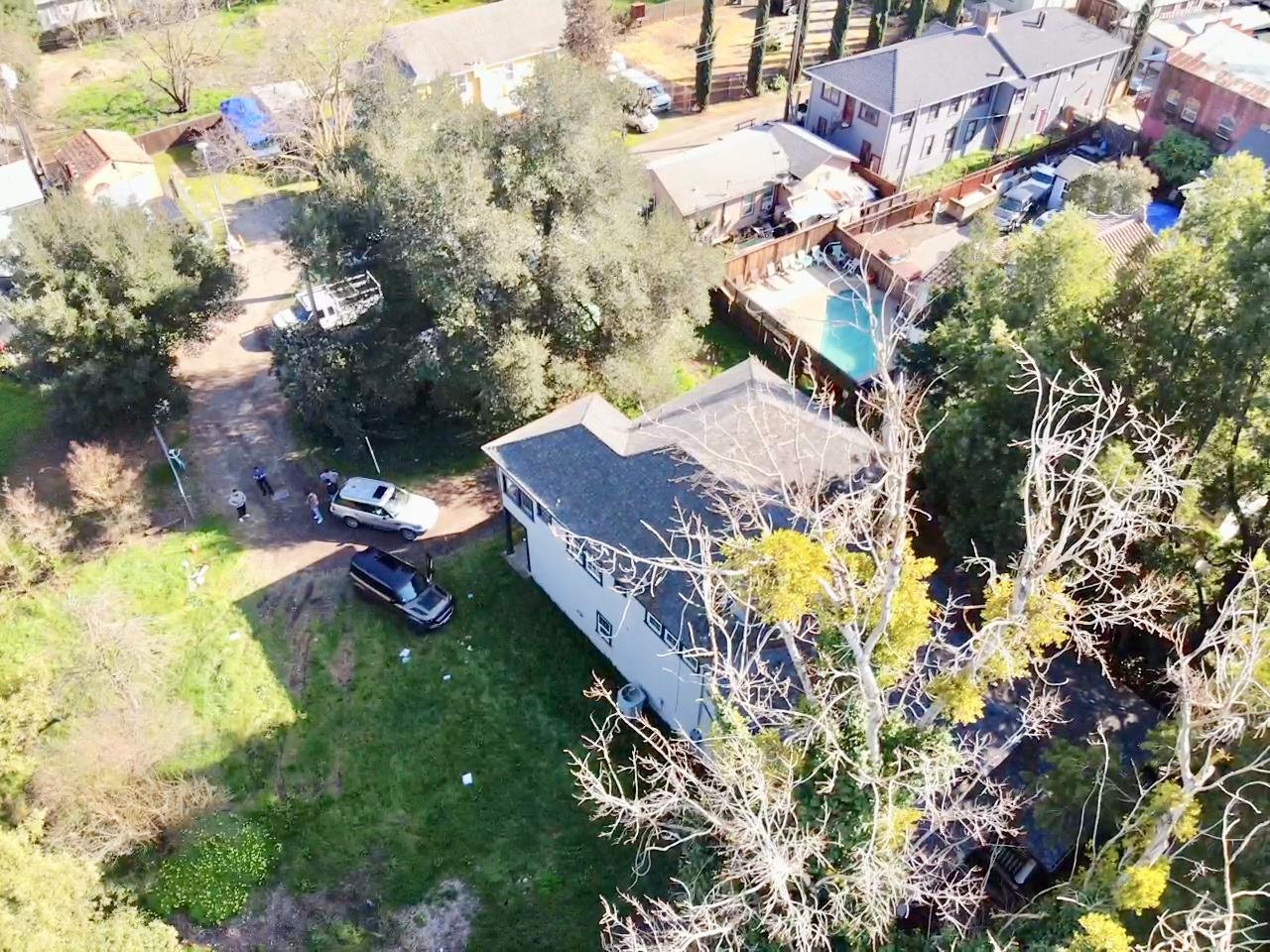 14055 River Road Walnut Grove, CA 95690 - Photo 42 of 55 a aerial view of a house with swimming pool and large trees