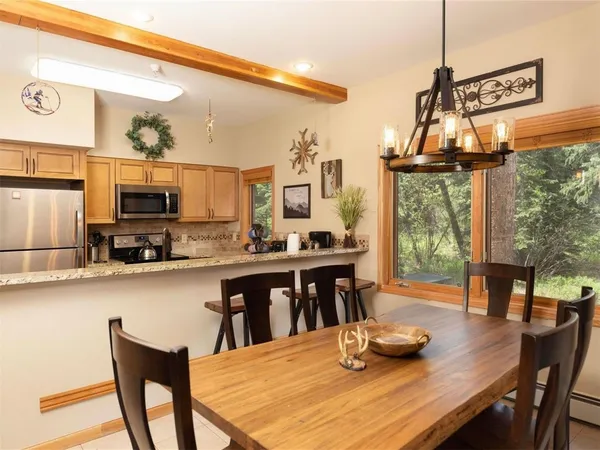 a dining room with furniture and window