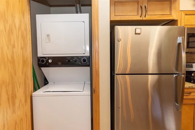 a white refrigerator freezer sitting inside of a kitchen