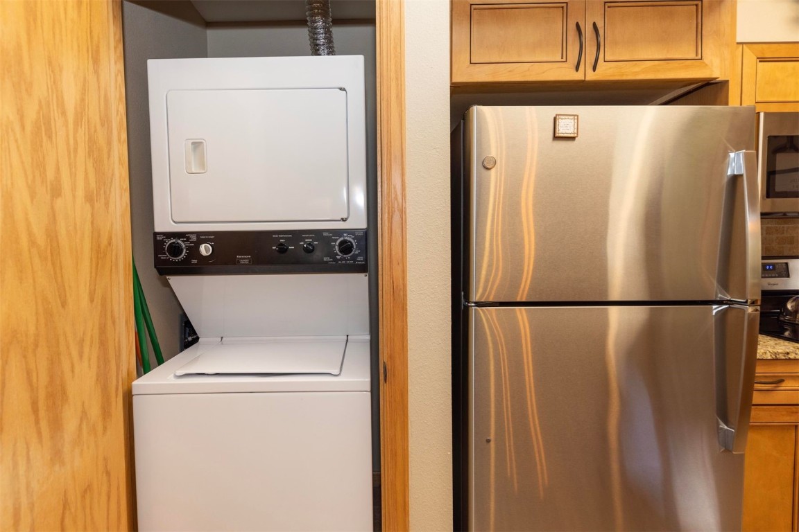 600 4 O Clock Road, Unit A11 Breckenridge, CO 80424 - Photo 19 of 22 a white refrigerator freezer sitting inside of a kitchen