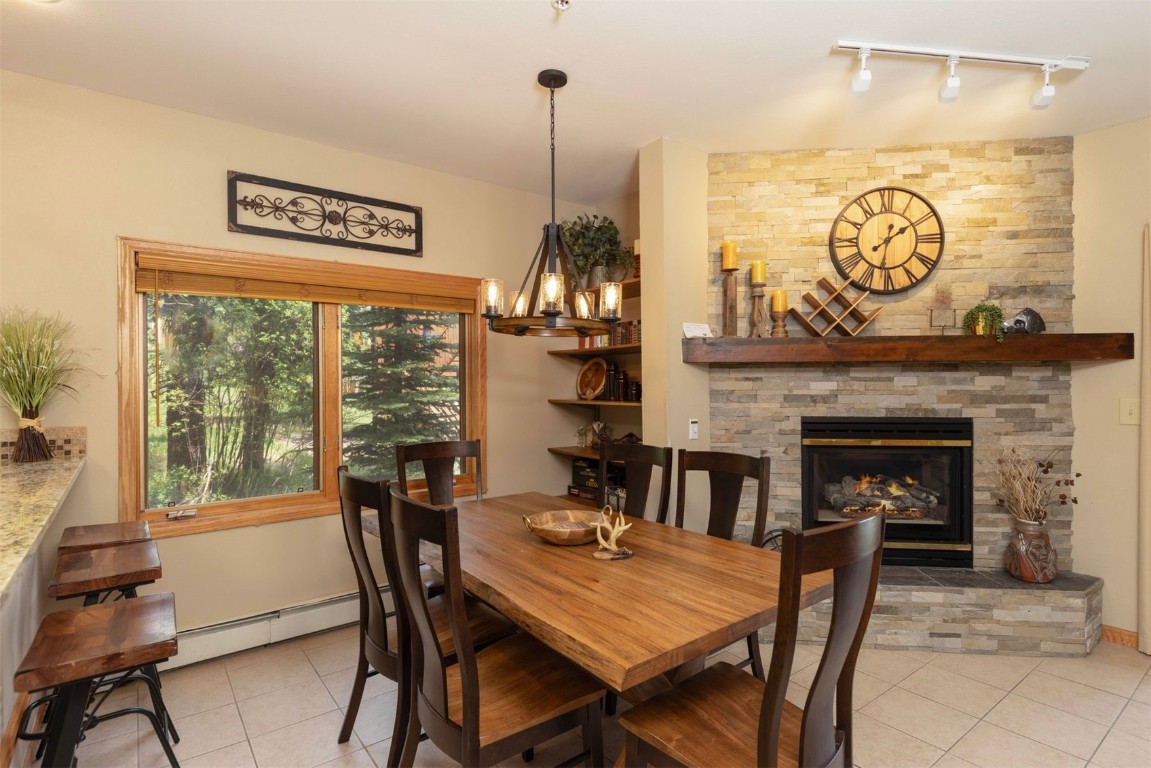 600 4 O Clock Road, Unit A11 Breckenridge, CO 80424 - Photo 4 of 22 a view of a dining room with furniture window and wooden floor